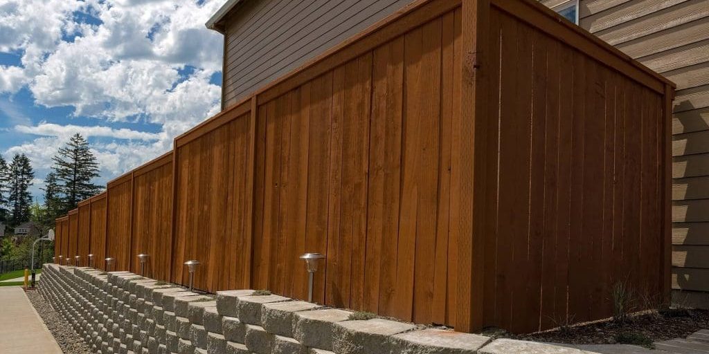 deck-fence-staining-london-ontario newly stained fence by professional painting company london ontario